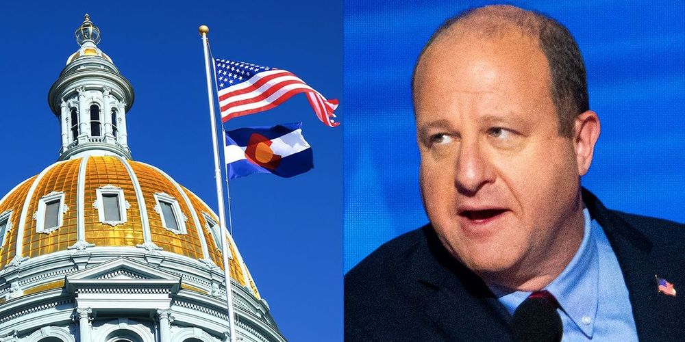 Colorado's gay governor denounces extremist group's flag lies