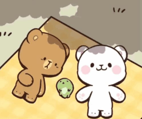 two teddy bears are standing next to each other and one bear has the letter t on its chest