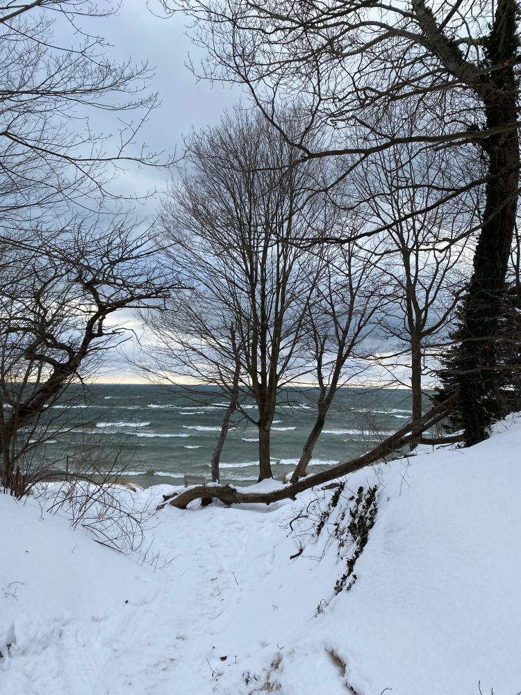 Lake Michigan waves with snow covered beach
