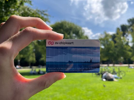 An OV-chipkaart (Netherlands transit card) held up in Vondelpark in Amsterdam