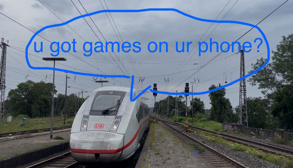 ICE approaching a station with a speech bubble drawn on to it that says “u got games on ur phone?”
