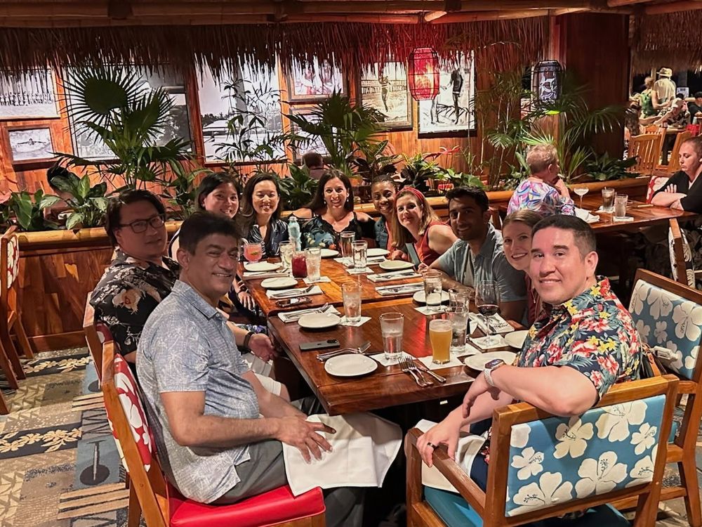 Conference attendees celebrate at a dinner.