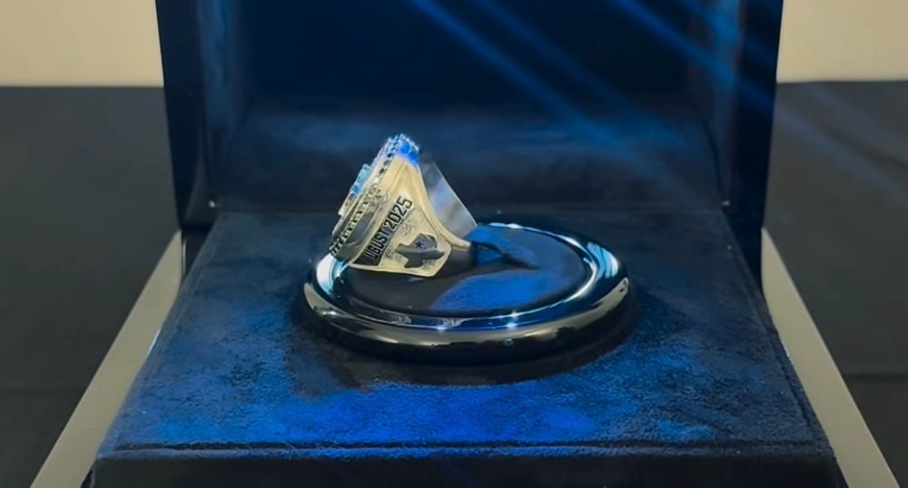 Side detail of the silver championship ring, which features an engraved Texas design and the concert date, August 2, 2025. 