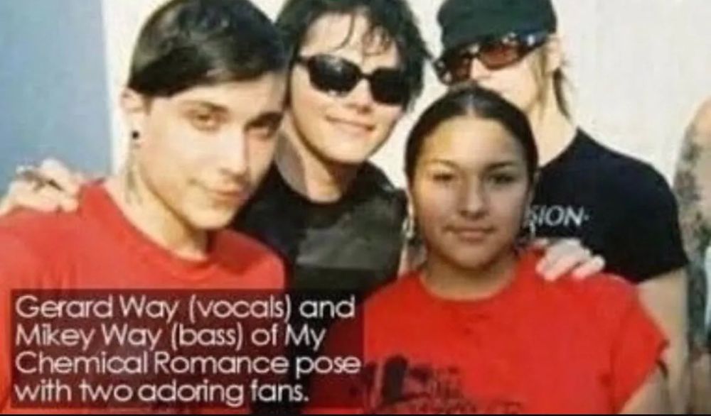 2005 photo of Frank, Gerard, Mikey and a fan, captioned, “Gerard Way (vocals) and Mikey Way (bass) of My Chemical Romance pose with two adoring fans.”
