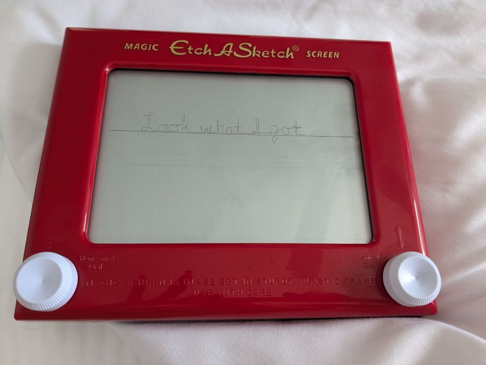 Pic of Etch-A-Sketch with "look what I got" written on it