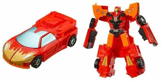Cybertron Legends red Hot Shot approximates the broad strokes of the Cybertron Excellion deco with the gold flames but also drops more Hot Rod vibes with a red head and chest and not pictured here (I will do a new photo for the wiki) orange spoiler wings 