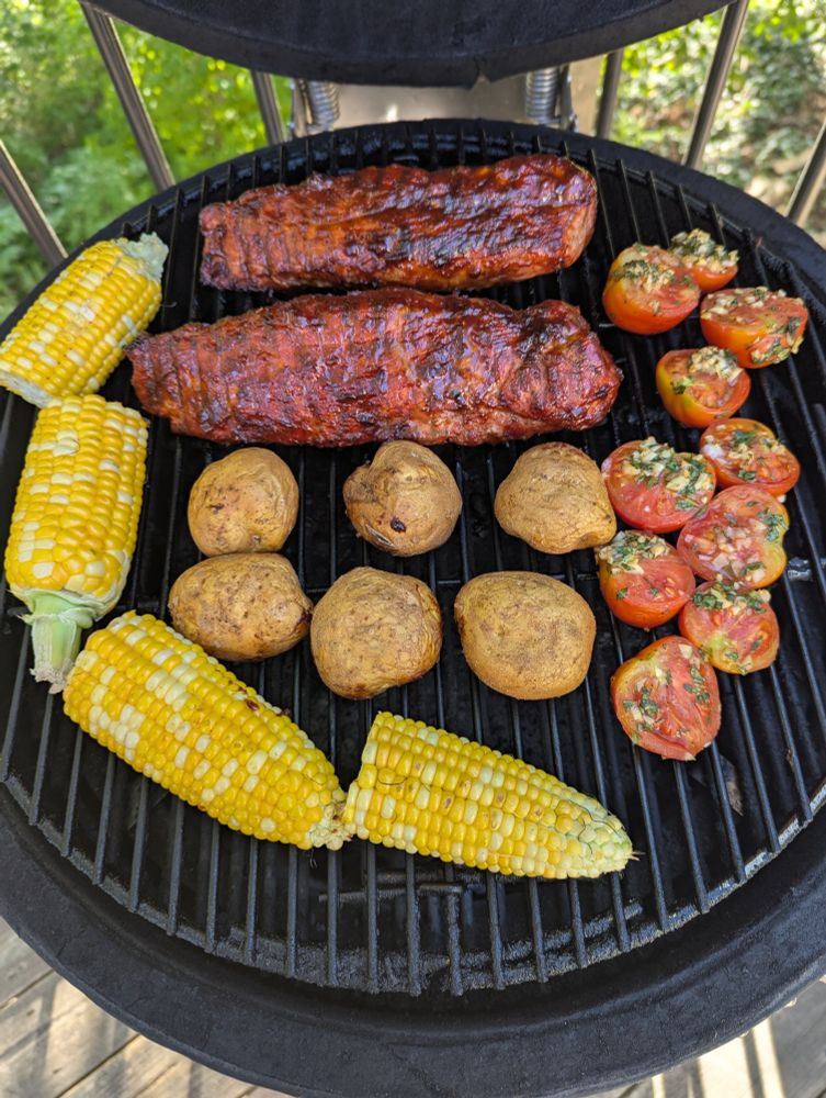 Pork tenderloin rubbed in Bone Dust then bathed in homemade chipotle BBQ sauce. New potatoes, roasted tomatoes with olive oil, garlic, basil and salt and pepper. Local corn.