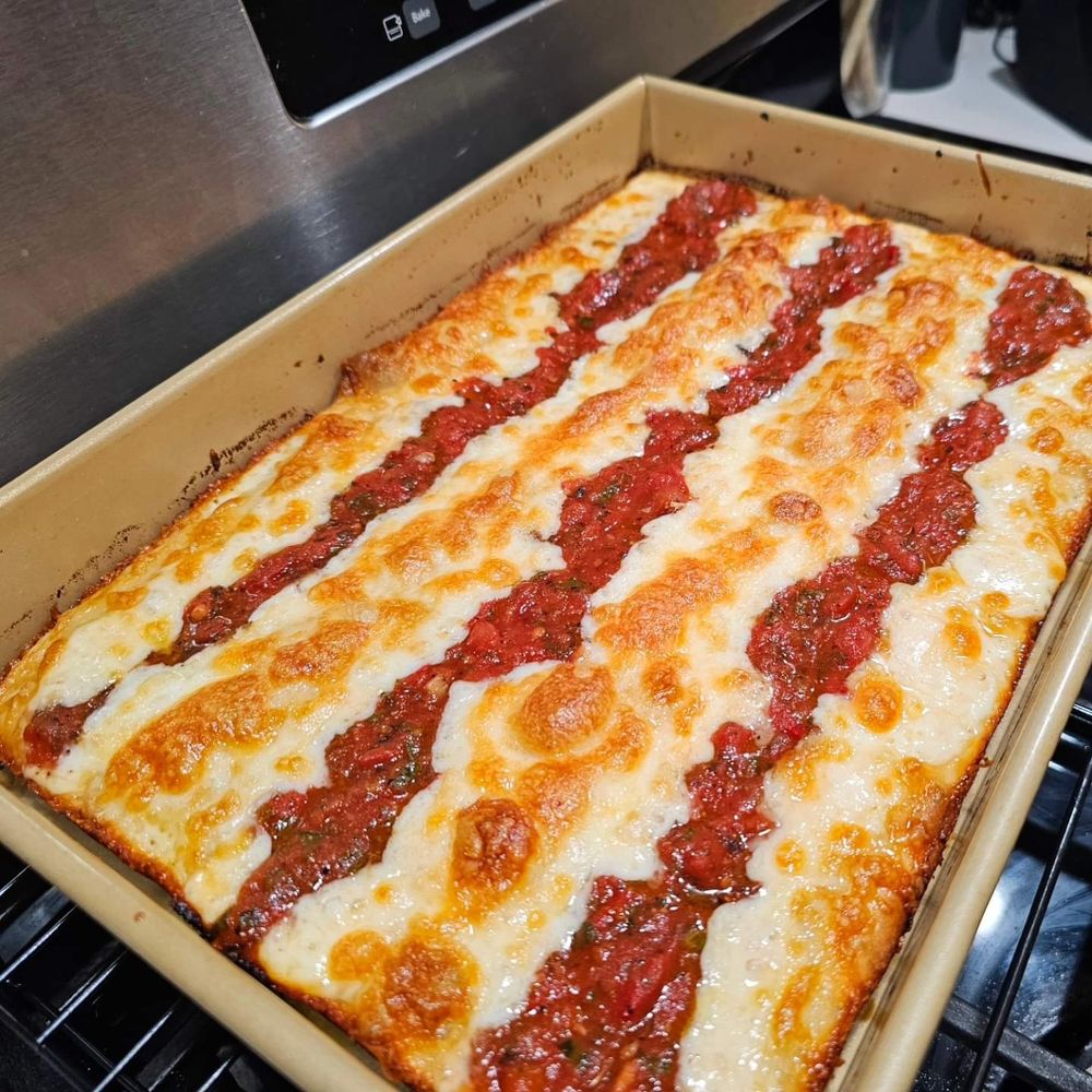Detroit Style Pizza with the rows of sauce and Monterey Jack Cheese