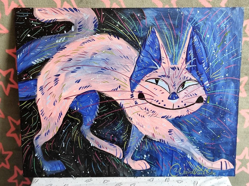 Acryllic painting of a pink and blue cat with various colourful strokes on a sprinkled black and blue background