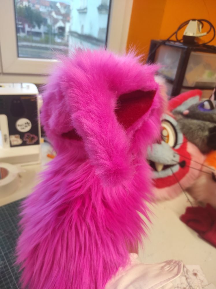 Picture of a pink fuzzy muppet-like puppet without yet a face 