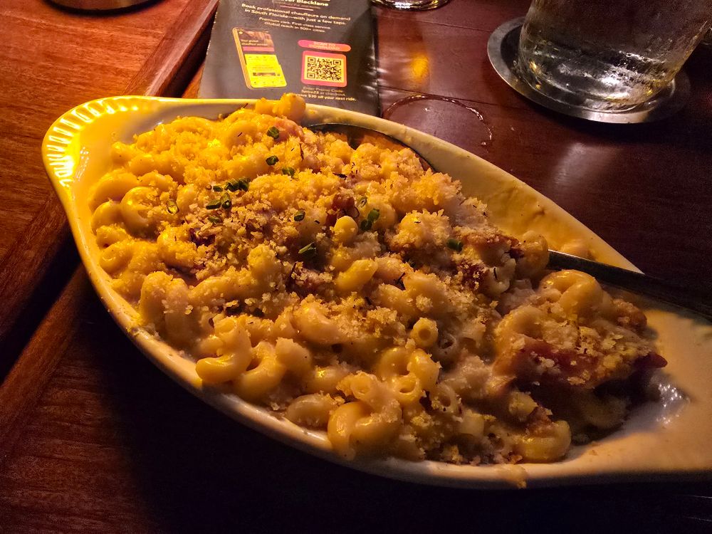 Creamy mac and cheese with toasted bread crumbs and crispy bacon pieces.