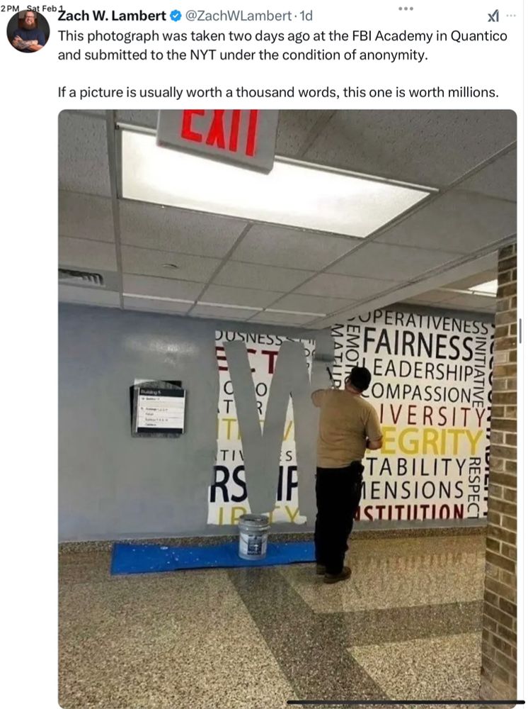 Highly symbolic photograph of a, compassion and diversity sign being painted over