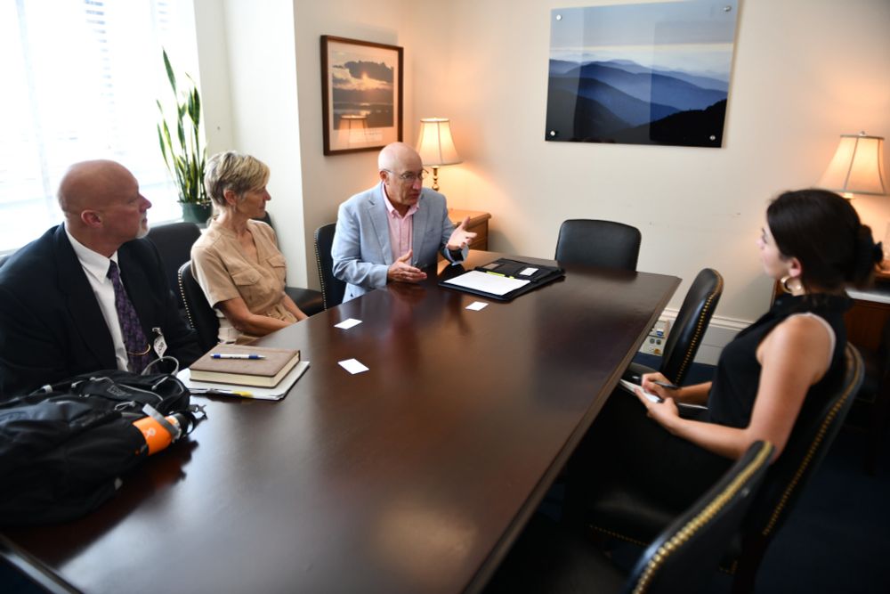 Doug Austen, Julie Claussen, and Jeff Kopaska meet with a Congressional staffer.