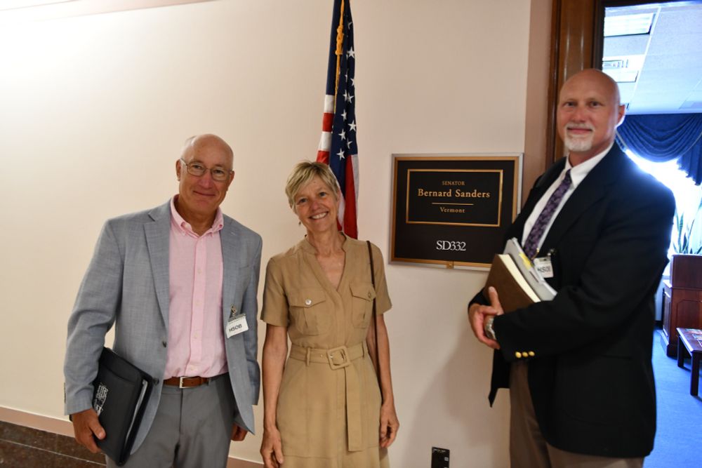 Doug Austen, Julie Claussen, and Jeff Kopaska outside Bernie Sanders' oficce.