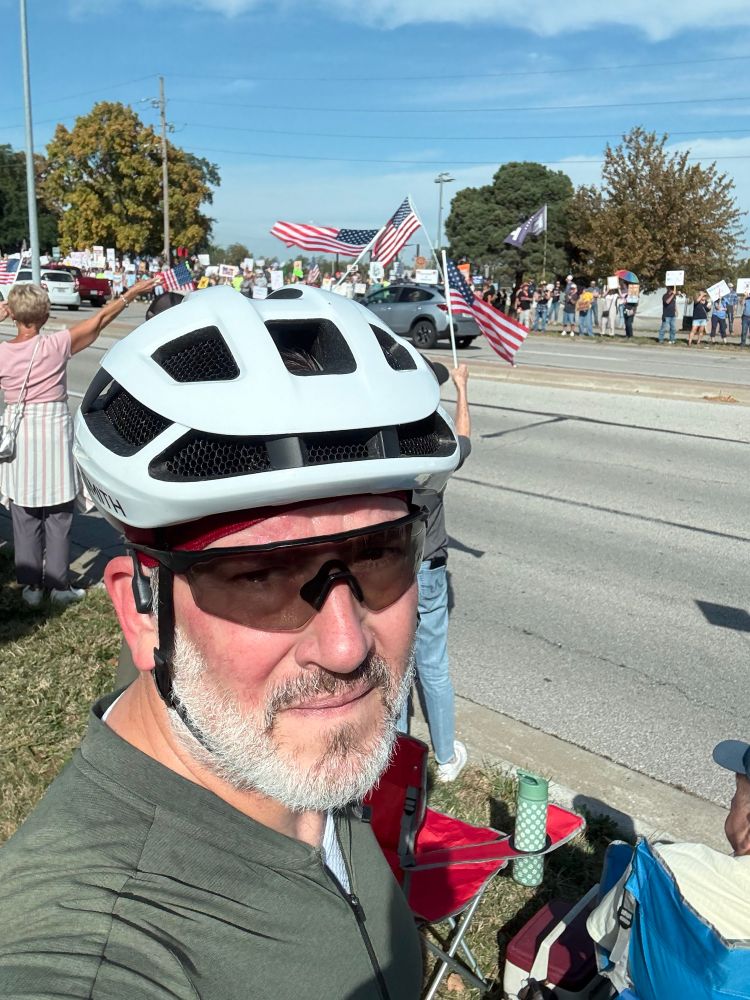 Selfie of me in white bicycle helmet at the No Kings protest in LSMO. 