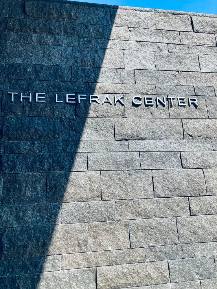 The words “The LeFrak Center” in metal letters on an exterior gray stone wall of the LeFrak Center at Lakeside. Aug 3, 2025.