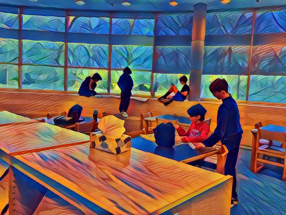 5 boys reading newspapers at tables or seated in windows