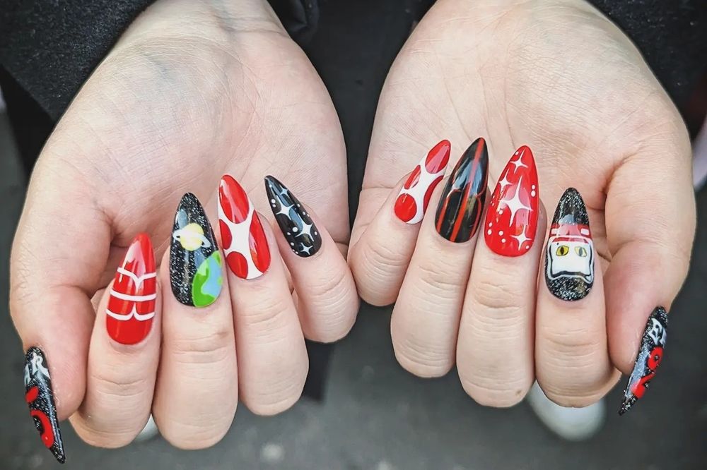 Two hands next to each other showcasing the set of press on nails described on the previous picture.