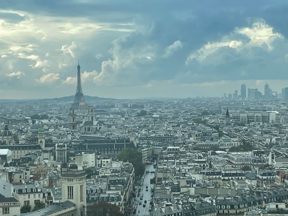 An image of the Paris skyline with the Eiffel Tower in the distance.