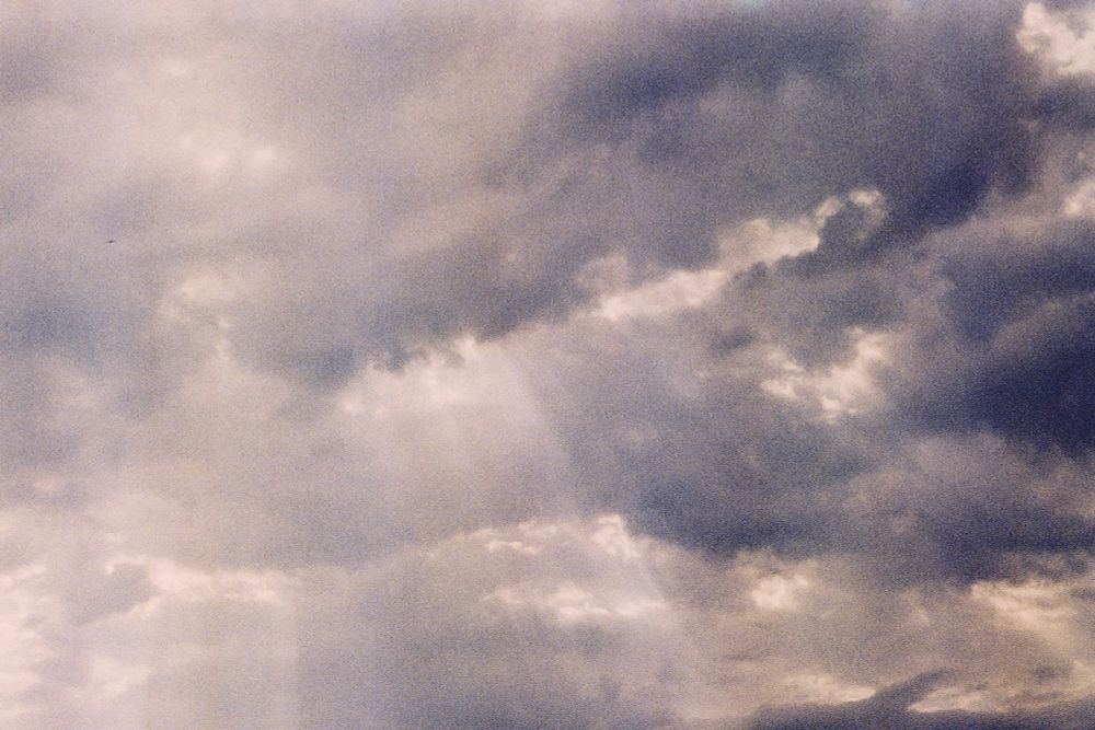 Dark clouds with "god rays" shining through.