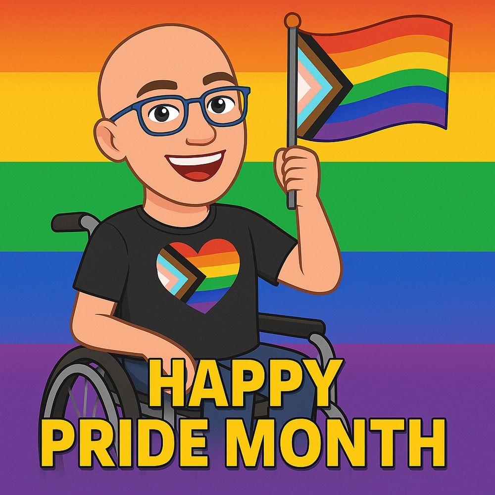 Bitmoji of smiling Michael Moore wearing a black t shirt with a large progress rainbow flag heart. He is sitting in a wheelchair and waving a progressive rainbow flag in his left hand. 