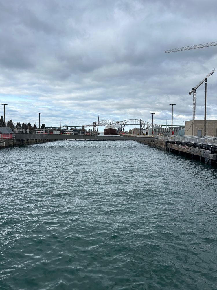 The M/V Hon. James L. Oberstar approaches the lock gate of the Poe Lock on another down-bound Soo passage.