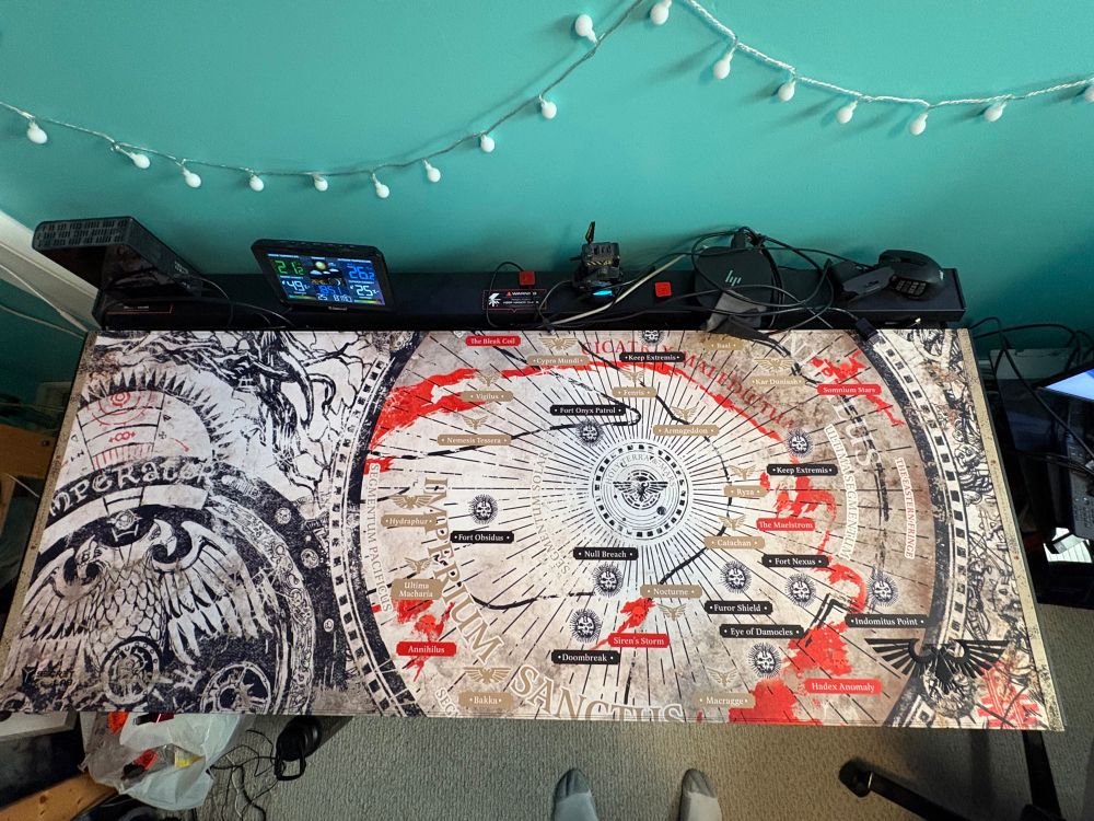 Warhammer 40k magpad desk mat from Secret Lab. Shows a map of the 40k galaxy with notable places like: Holy Terra & Mars, Fenris and Maccrage 