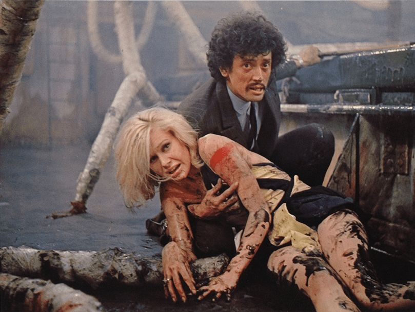 Suzanna Leigh and Ben Carruthers fend off some greasy tentacles 