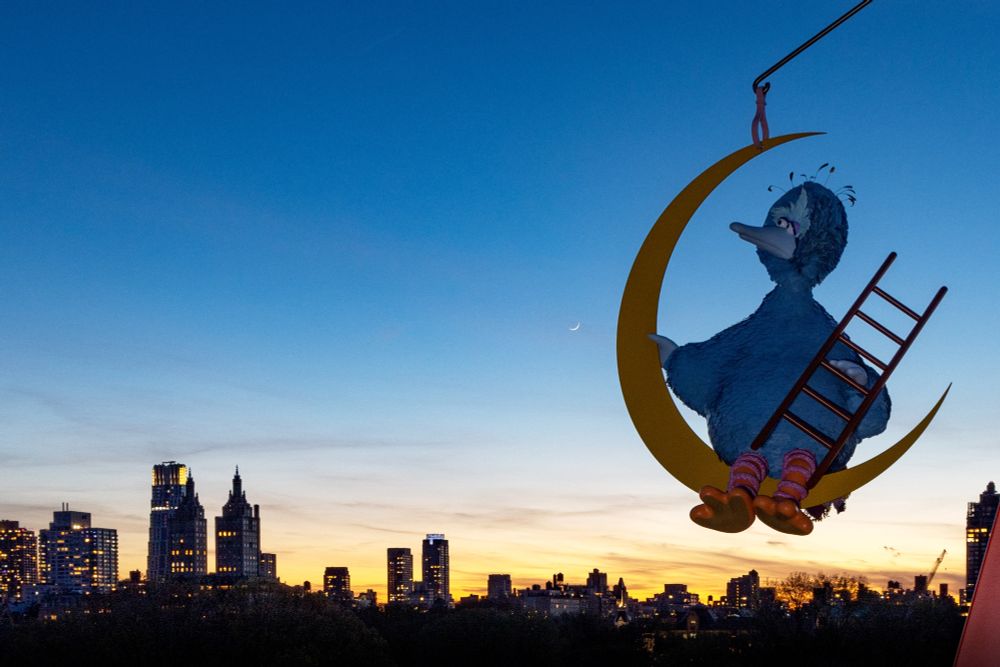 Image of NYC skyline with Big Bird-like figure (in Blue) on a crescent moon shape holding a ladder