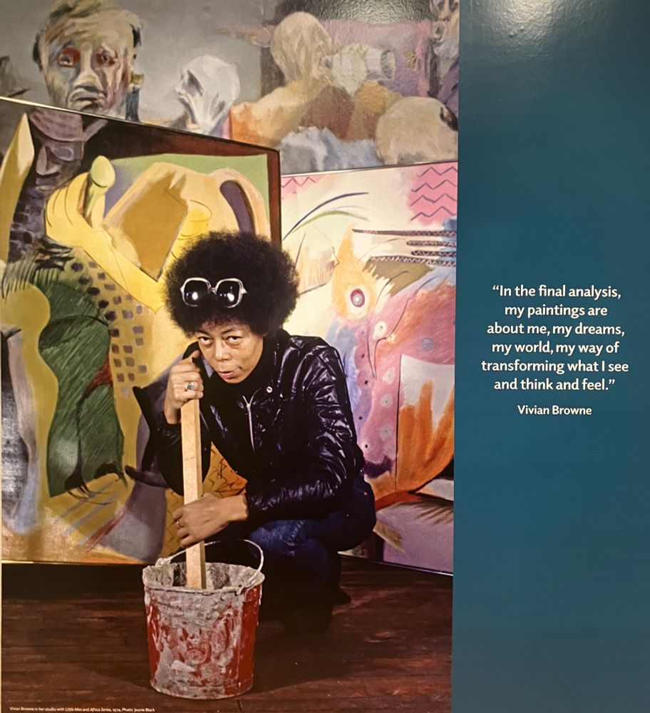 Photo of woman kneeling with wooden stick in bucket, with paintings behind her, and quote about her work as an artist