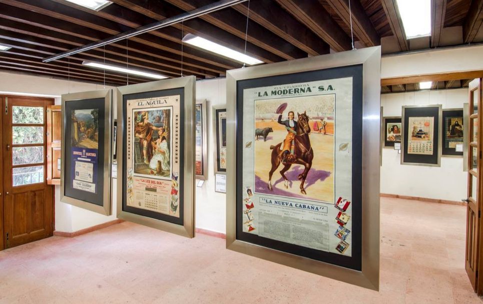 Interior of an exhibition space featuring calendar art