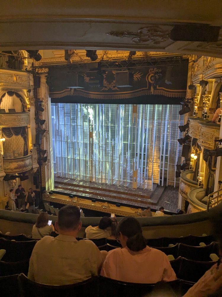 Photo of stage for opening of My Master Builder, a translucent glass looking structure fills the stage.