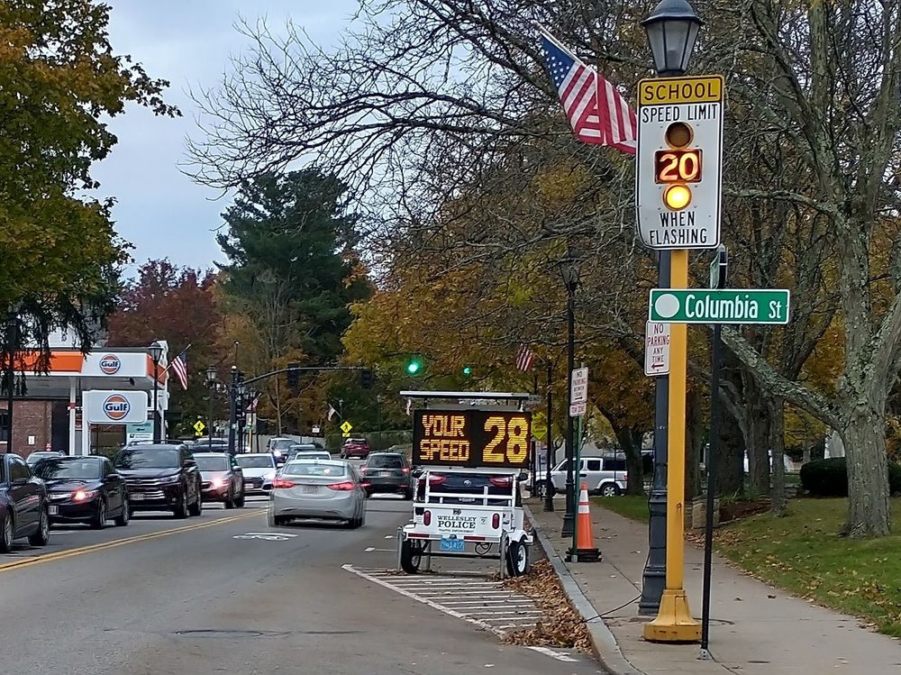 Street scene.  "School speed limit 20 when flashing".  It's flashing.  "Your speed 28".
