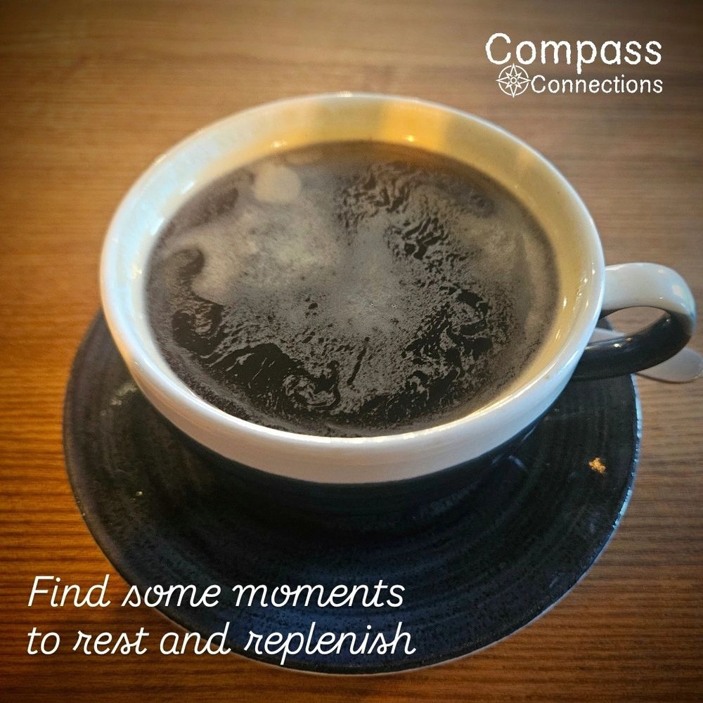 Cup of black coffee on a wooden table