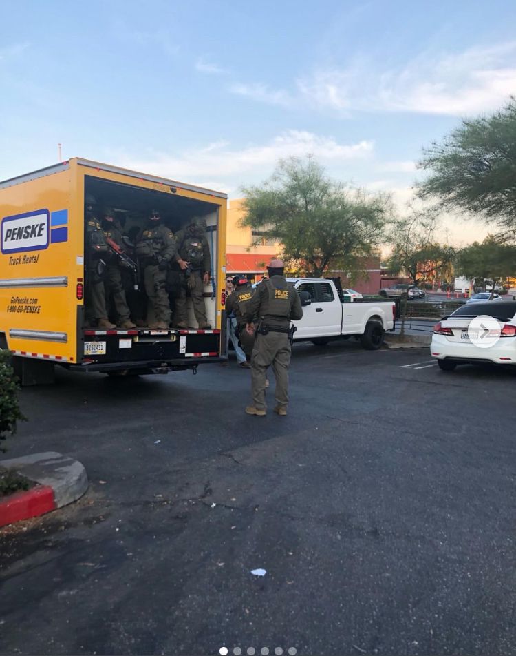 Border Patrol agents masked up in the back of a Penske rental truck at the Westlake Home Depot