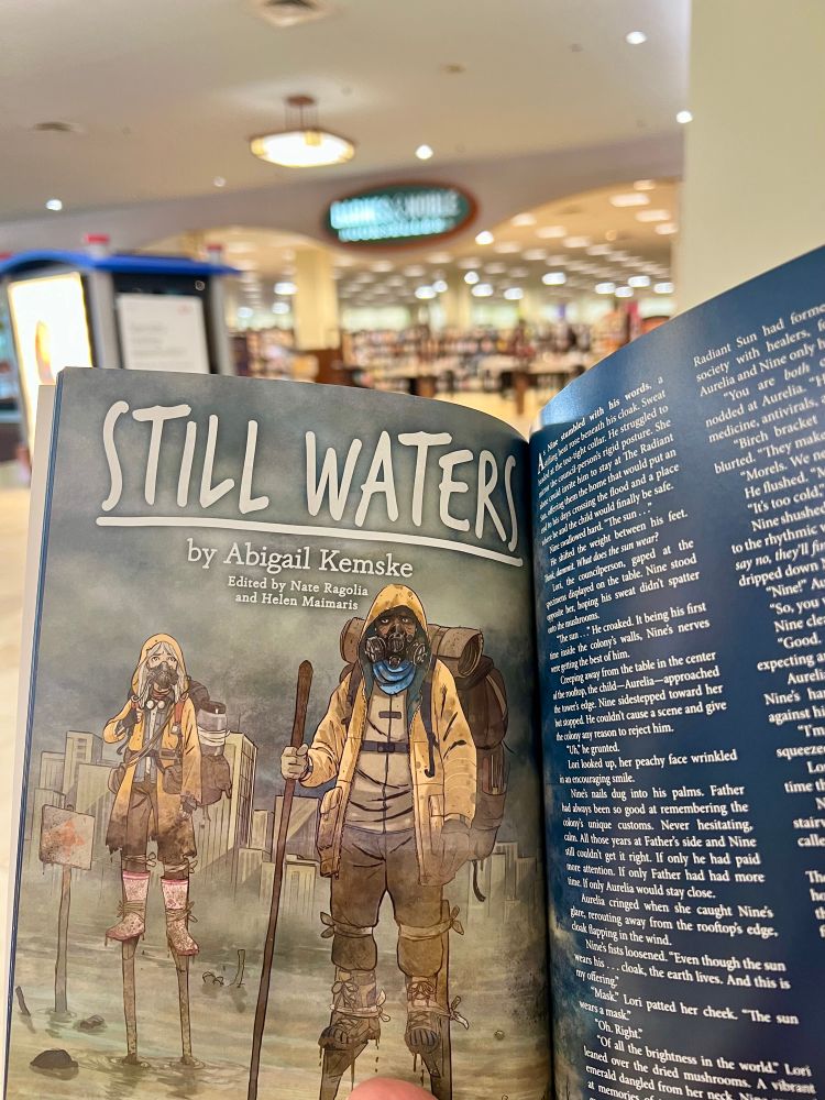 Picture of inside a magazine featuring a story titles “Still Waters” and an illustration of two characters wearing respirators and walking through a flood on stilts.