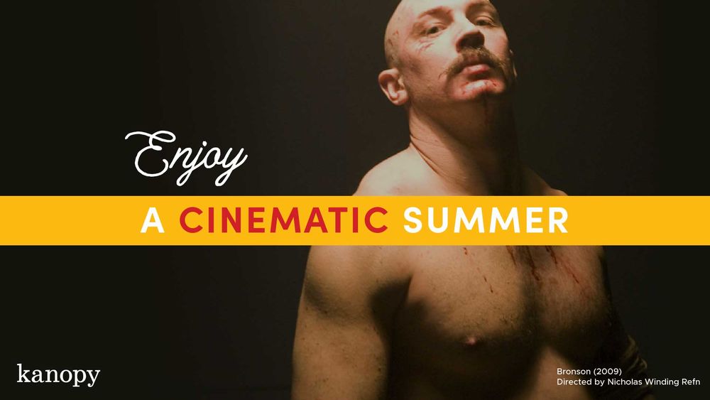 Shirtless Tom Hardy with blood on his chest looking at the viewer. Copy reads Enjoy A Cinematic Summer.