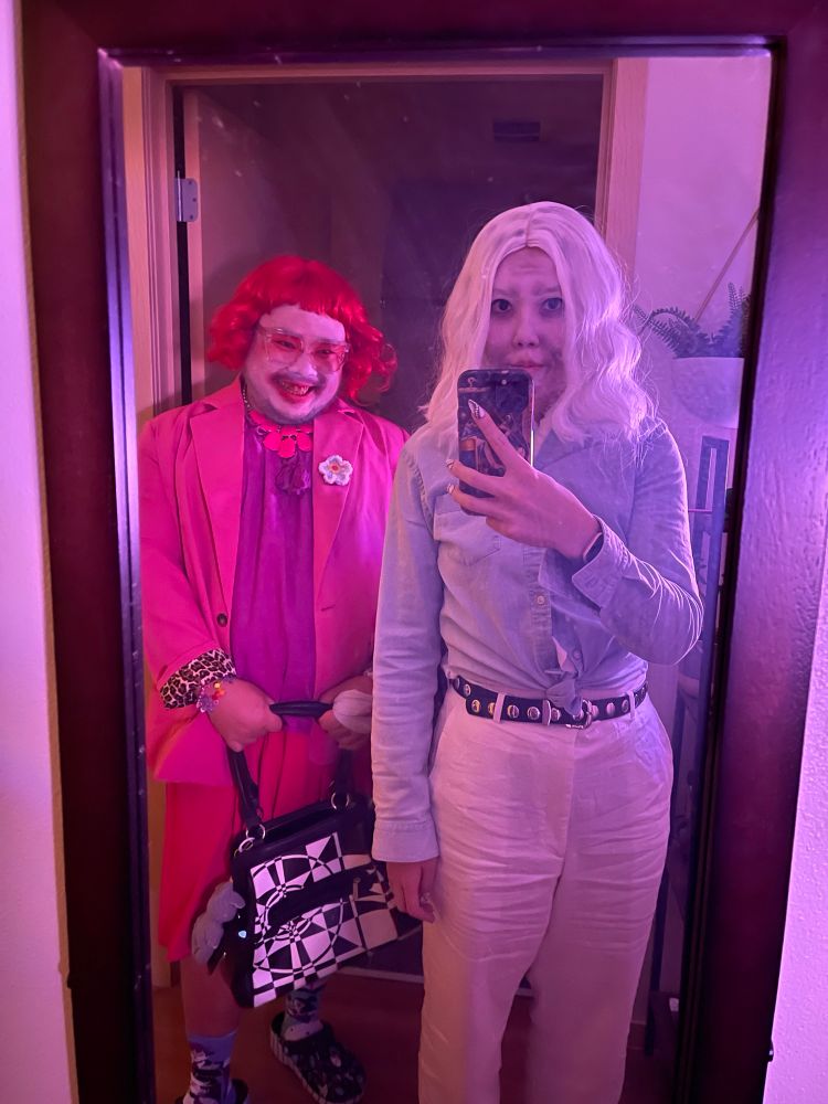 Danny and banana dressed up as Gladys and longlegs in a mirror 