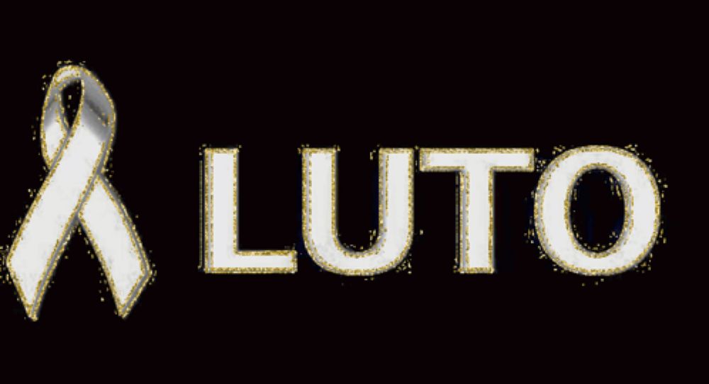 a white ribbon with the word luto written on it