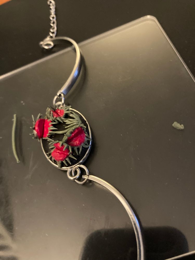 A silver bracelet with a Venus fly trap