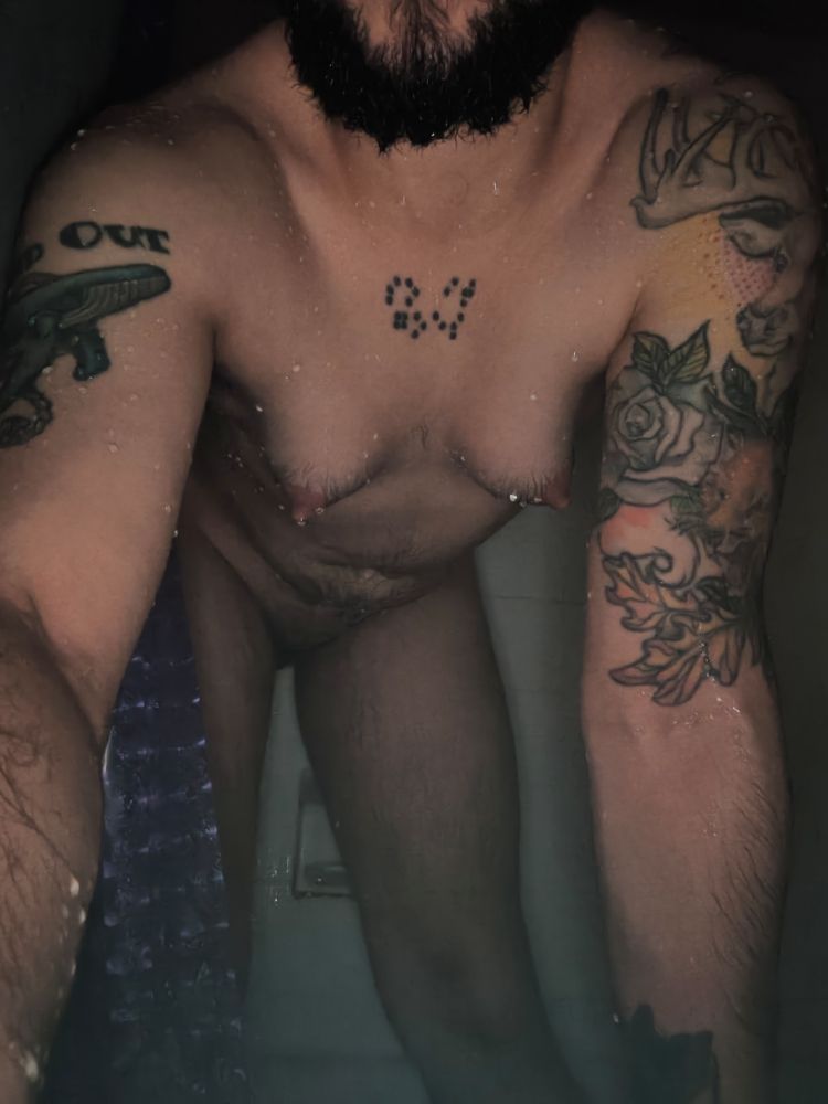 a photo of me naked in the shower, my tits glistening from water droplegs
