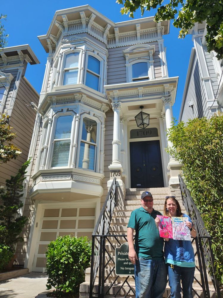 Megan and Jeff pose in front of the Full House house