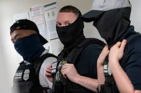 Photo of ICE agents wearing masks 