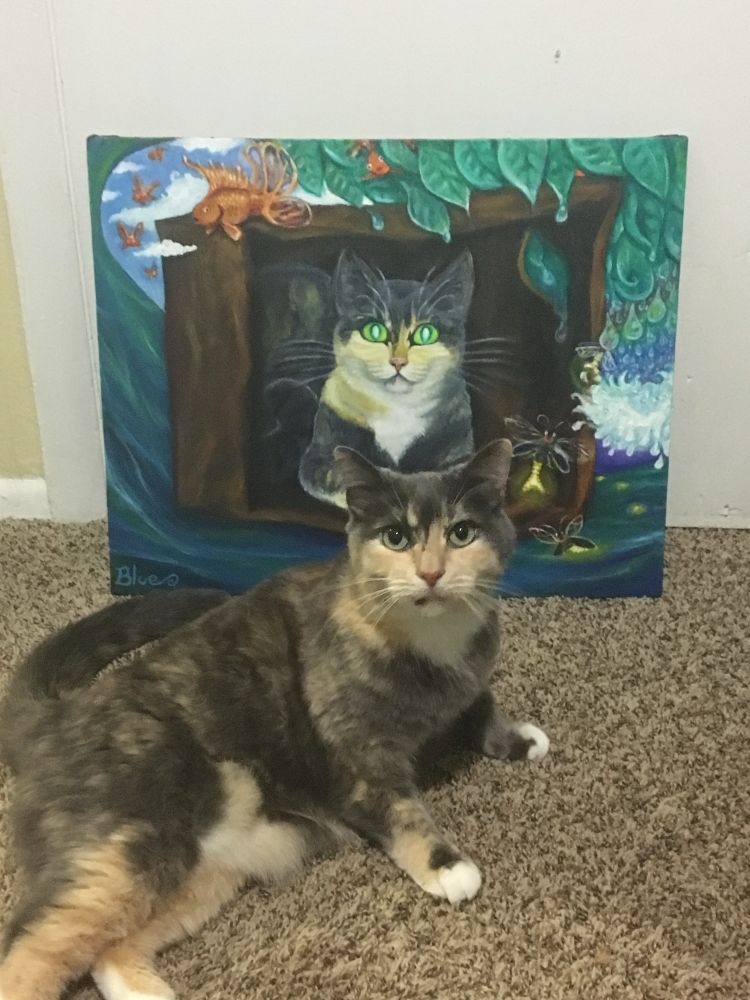 A dilute calico cat looks at the viewer in front of a surreal painting of her lounging in a box as it floats on a wave. The wave curls up and water drops morph into leaves above her head. A line of fireflies emerge from the water to fly into the leaves with winged goldfish emerging from the other side, flying away.
