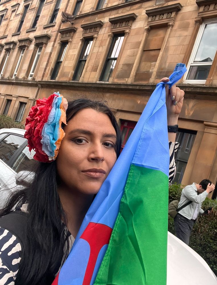 Selfie of me holding the Roma flag 