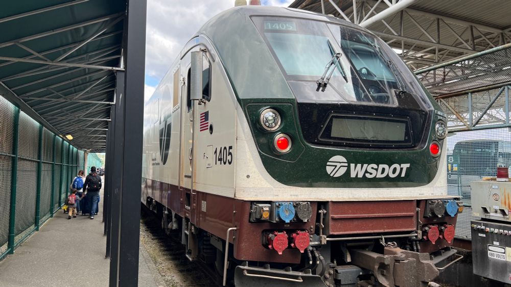 A Washington State Department of Transport engine pulled up at a station platform 