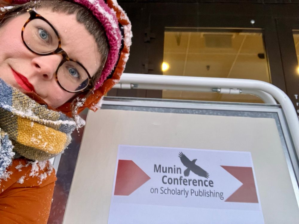 Me and the “Munin Conference on Scholarly Publishing” sign