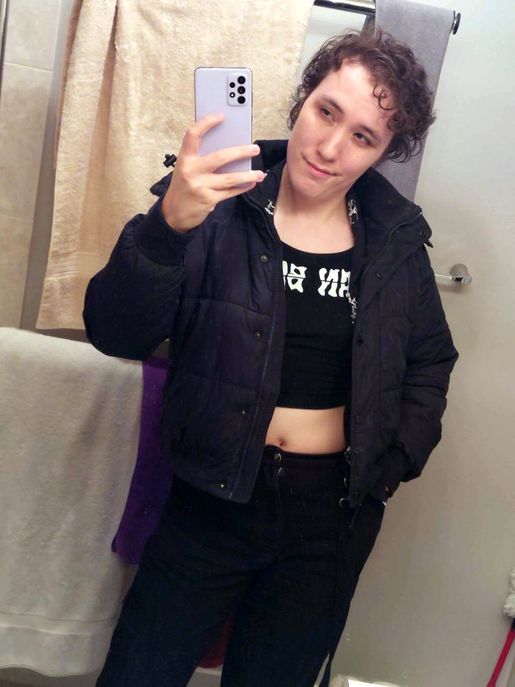 bathroom selfie, I'm wearing a puffy jacket and a mean bikini crop top, and my hair looks *clean* with none of the weird flyaway hairs on the side that always make me super insecure