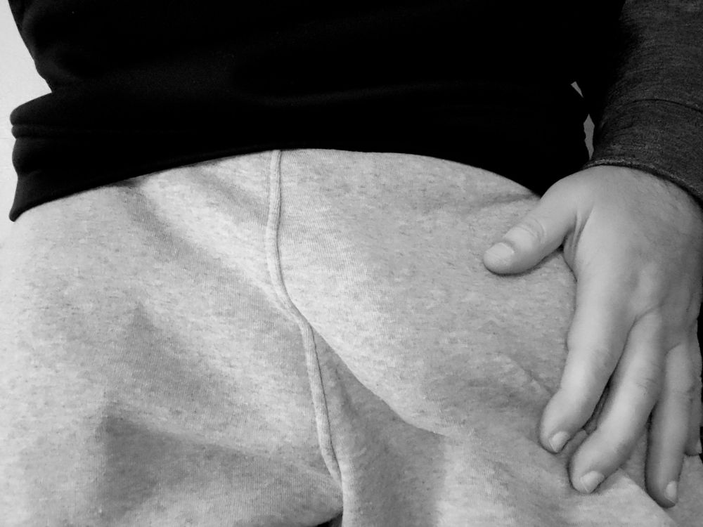 Gray sweats and a hand