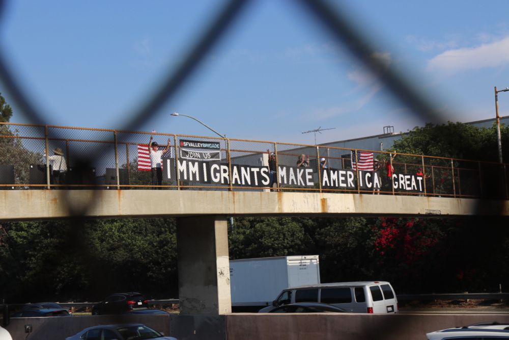 "We’re taking their MAGA phrase and redefining it to remind them how important immigrants are, and the flags are used as a form to take back the flag and remind ourselves that this is the United State...